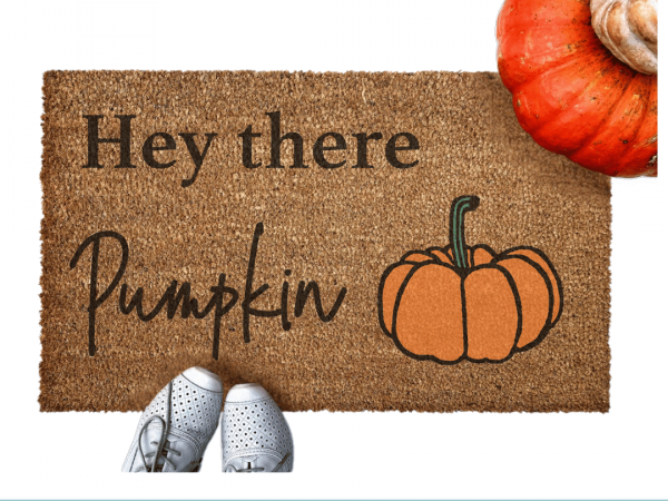 lifestyle photo Hey there Pumpkin coir outdoor Doormat with cute white shoes