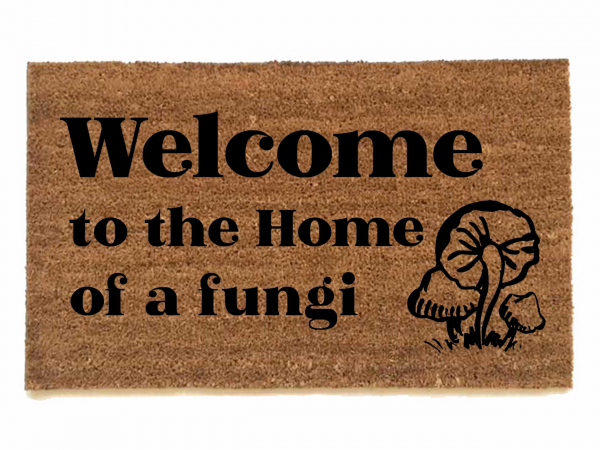 photo of outdoor coir doormat reading welcome to the home of a fungii mushrooms