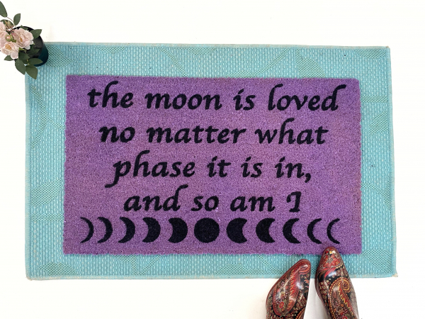 purple coir doormat with moon phase image and saying The moon is loved