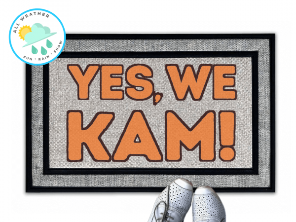 coir doormat reading "Yes we Kam!" in bright orange