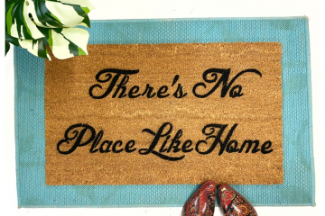There's no place like home-  Frank L Baum doormat