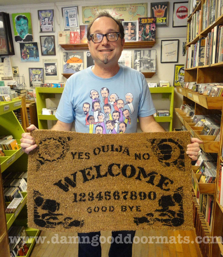 Rupert at Normal's Books with Ouija doormat